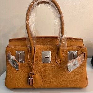 Genuine Leather Shoulder Bag, size 29, with silver hardware.